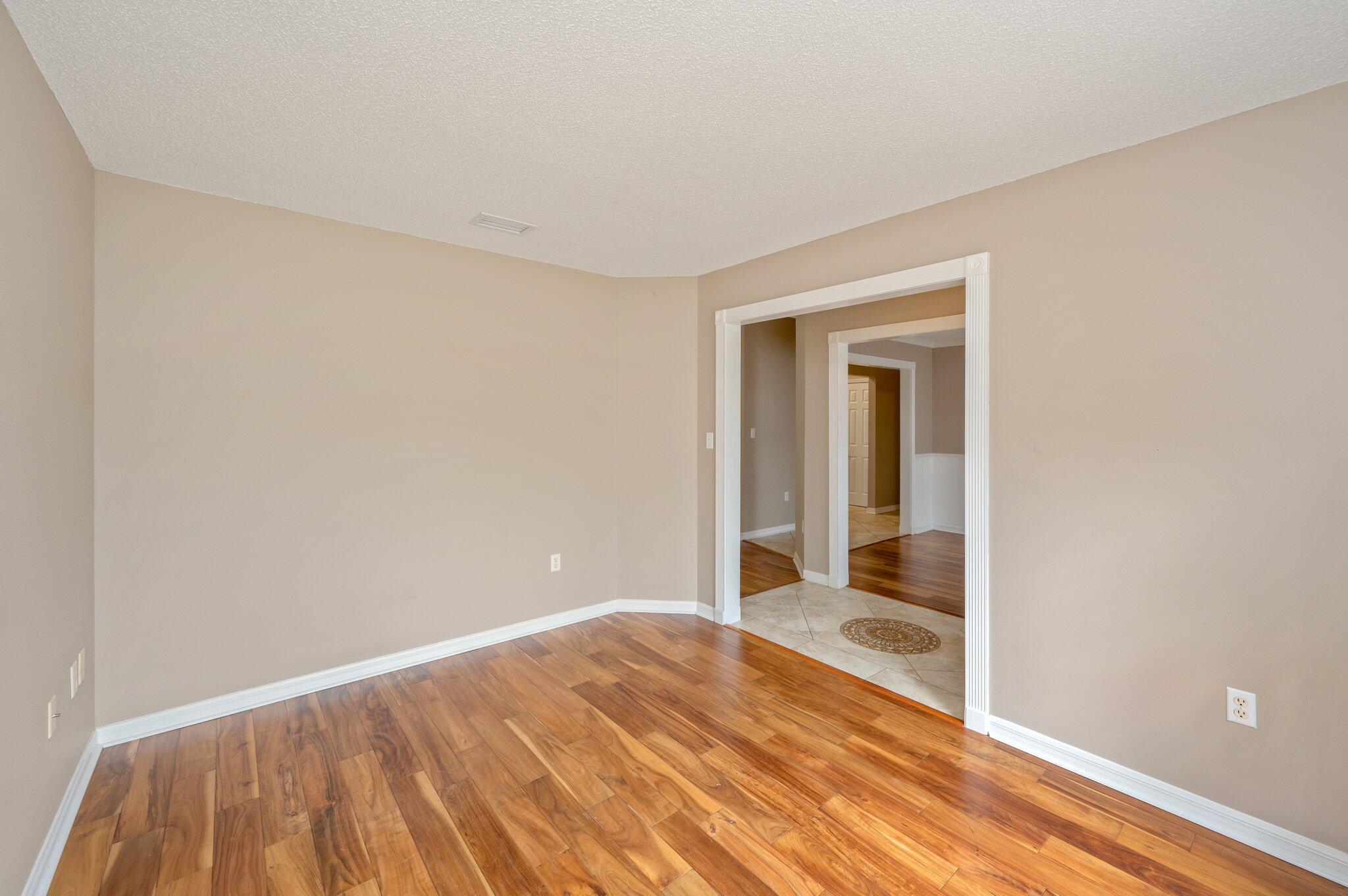 4752 Balboa Road Crestview, FL 32539 - Photo 19 of 46 a view of a room with wooden floor and bathroom