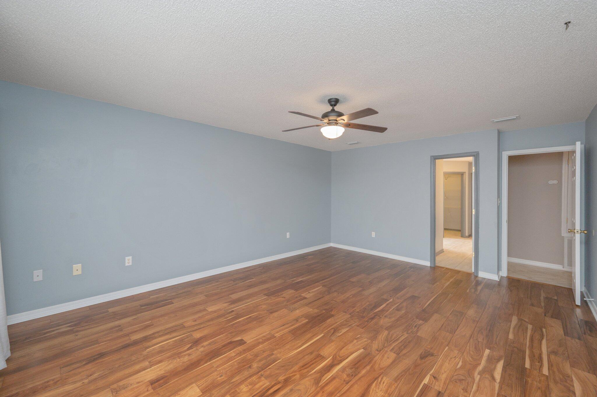 4752 Balboa Road Crestview, FL 32539 - Photo 21 of 46 a view of an empty room with wooden floor