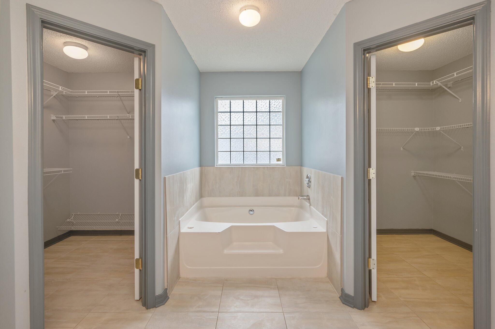 4752 Balboa Road Crestview, FL 32539 - Photo 25 of 46 a bathroom with a bathtub and shower