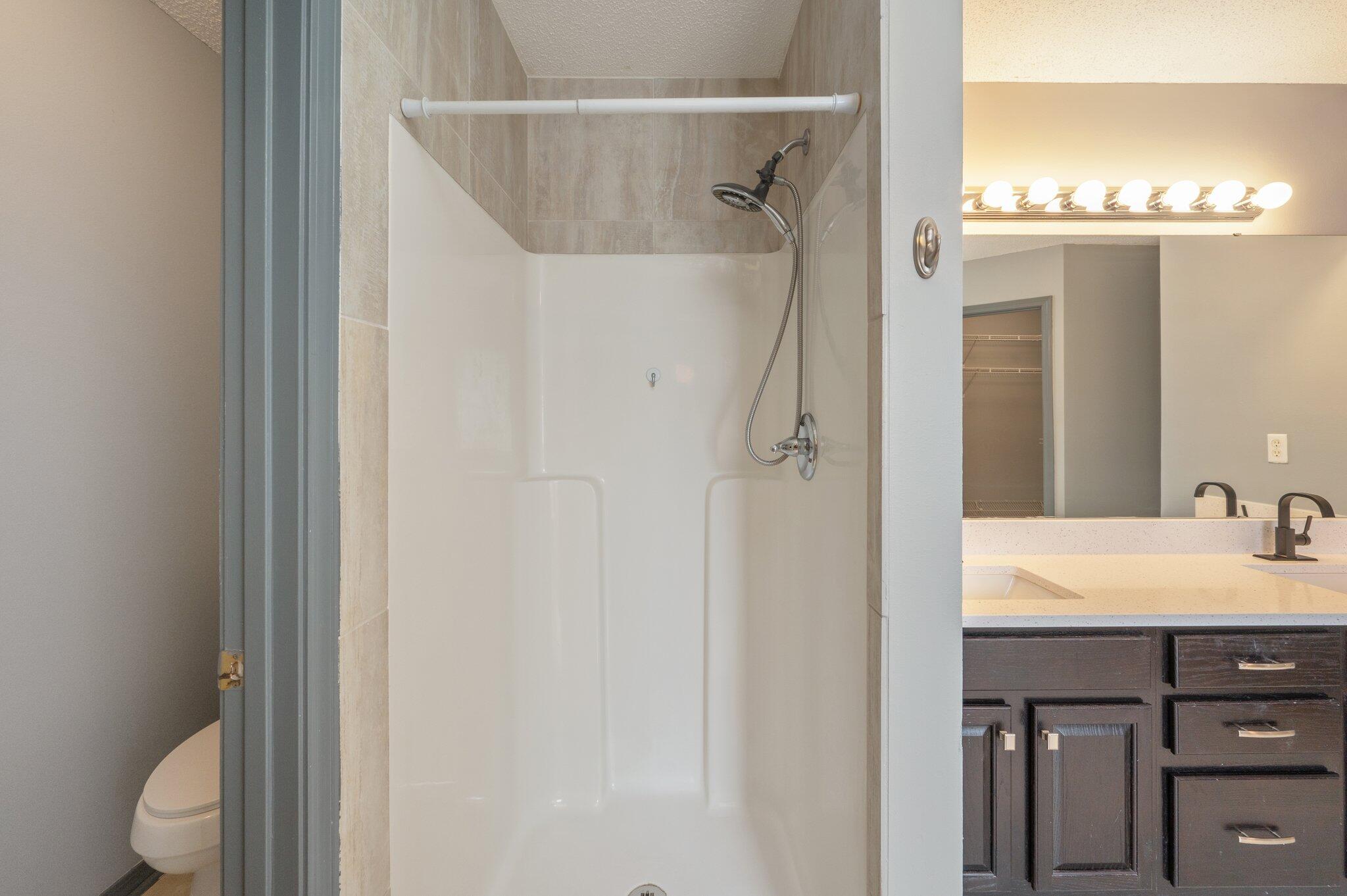 4752 Balboa Road Crestview, FL 32539 - Photo 27 of 46 a bathroom with a sink vanity mirror and toilet