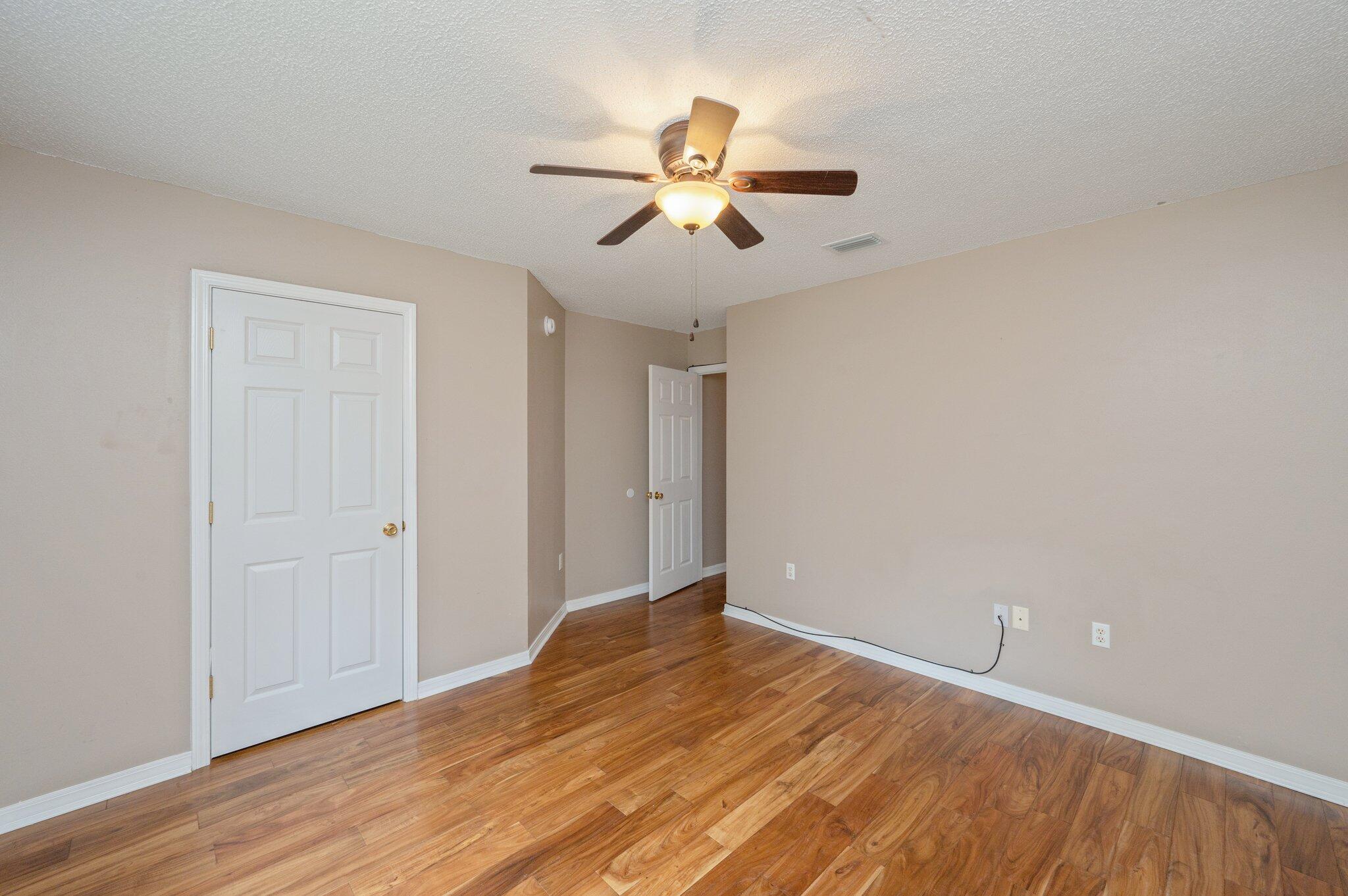 4752 Balboa Road Crestview, FL 32539 - Photo 34 of 46 a view of empty room with wooden floor