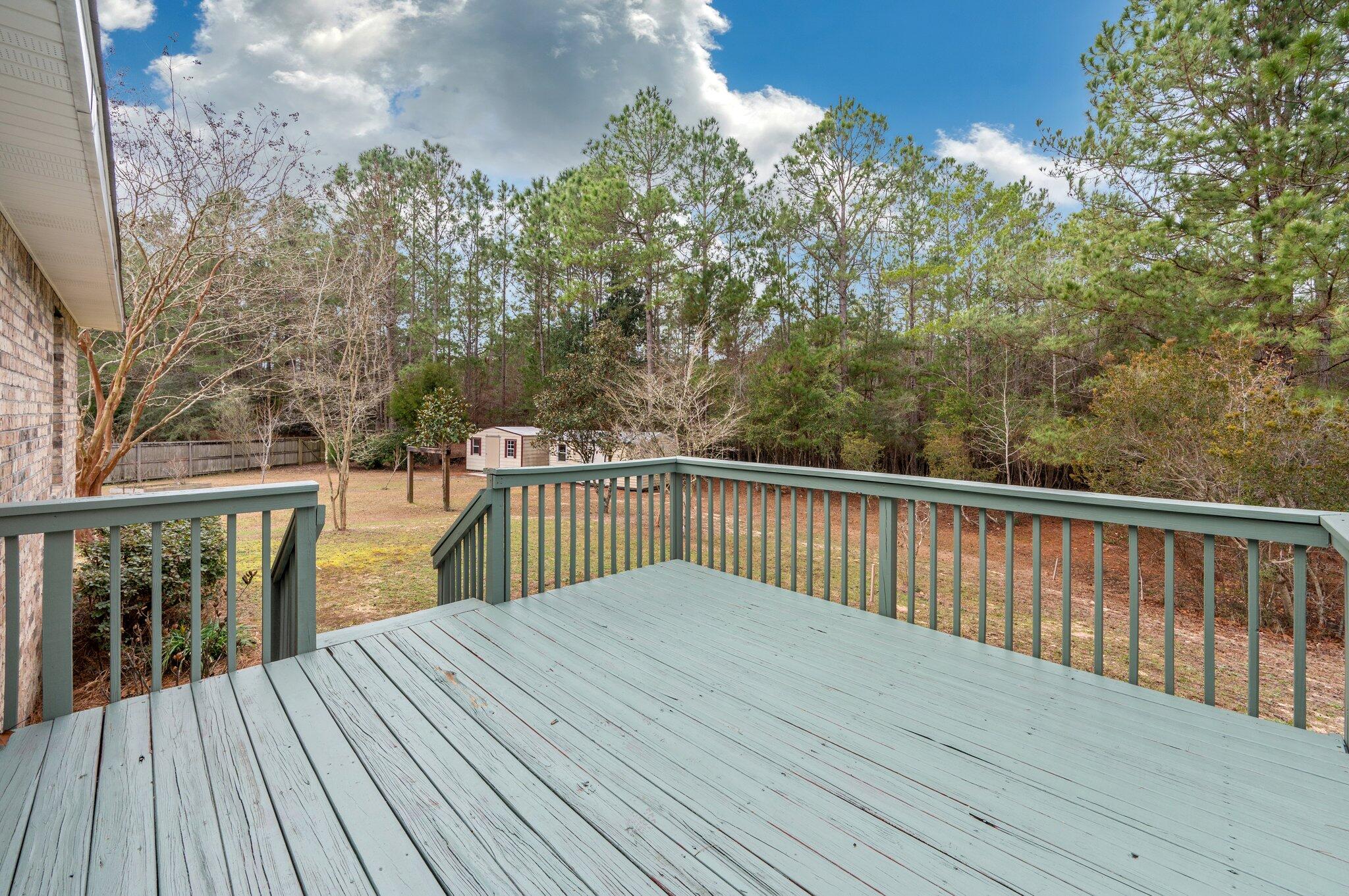 4752 Balboa Road Crestview, FL 32539 - Photo 39 of 46 a balcony with wooden floor and fence