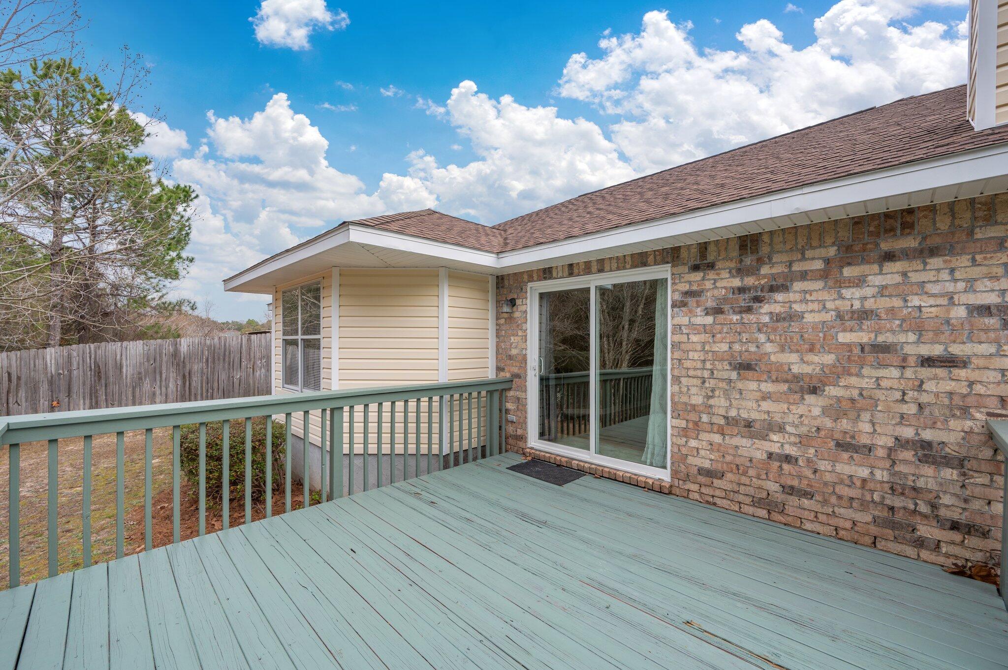 4752 Balboa Road Crestview, FL 32539 - Photo 40 of 46 a balcony with wooden floor