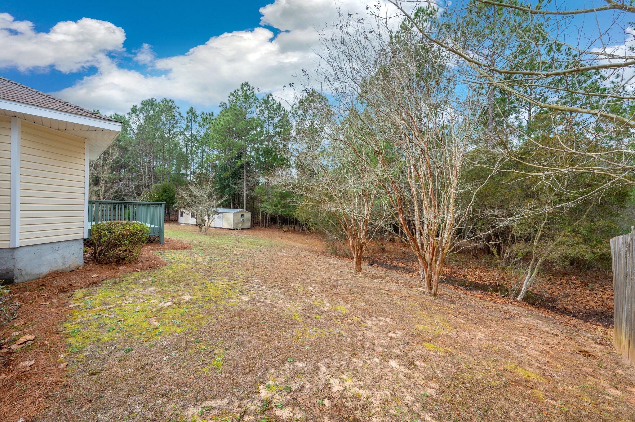 4752 Balboa Road Crestview, FL 32539 - Photo 44 of 46 a view of a backyard with large trees