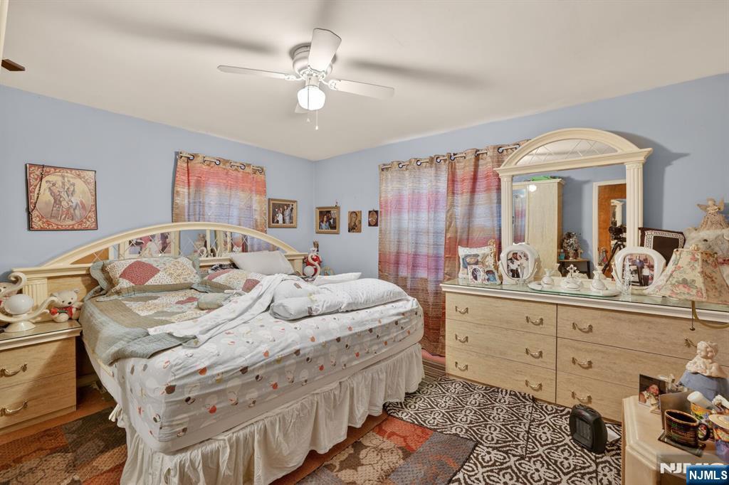 736 Vivian Terrace Union, NJ 07083 - Photo 4 of 16 a view of a bedroom with furniture and chandelier