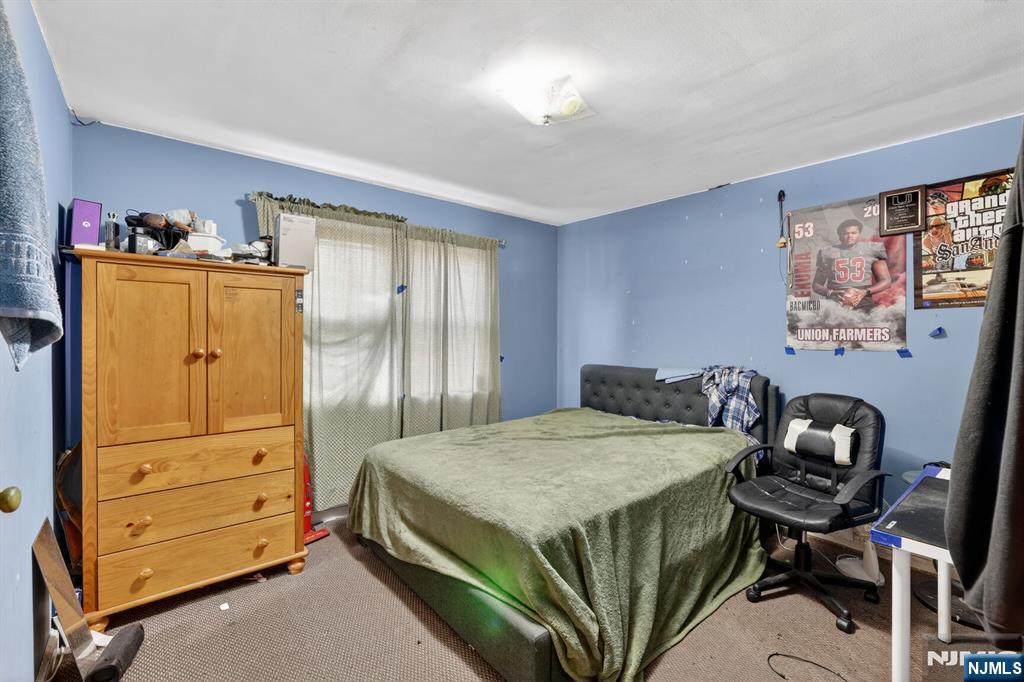 736 Vivian Terrace Union, NJ 07083 - Photo 5 of 16 a bedroom with a bed and furniture