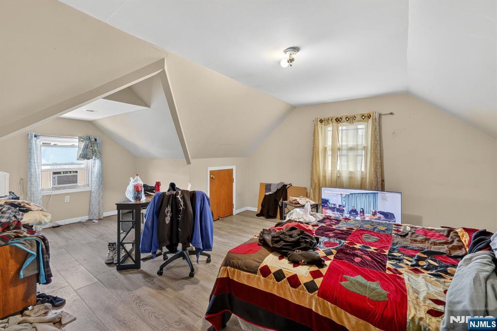 736 Vivian Terrace Union, NJ 07083 - Photo 8 of 16 a bedroom with two beds and a window