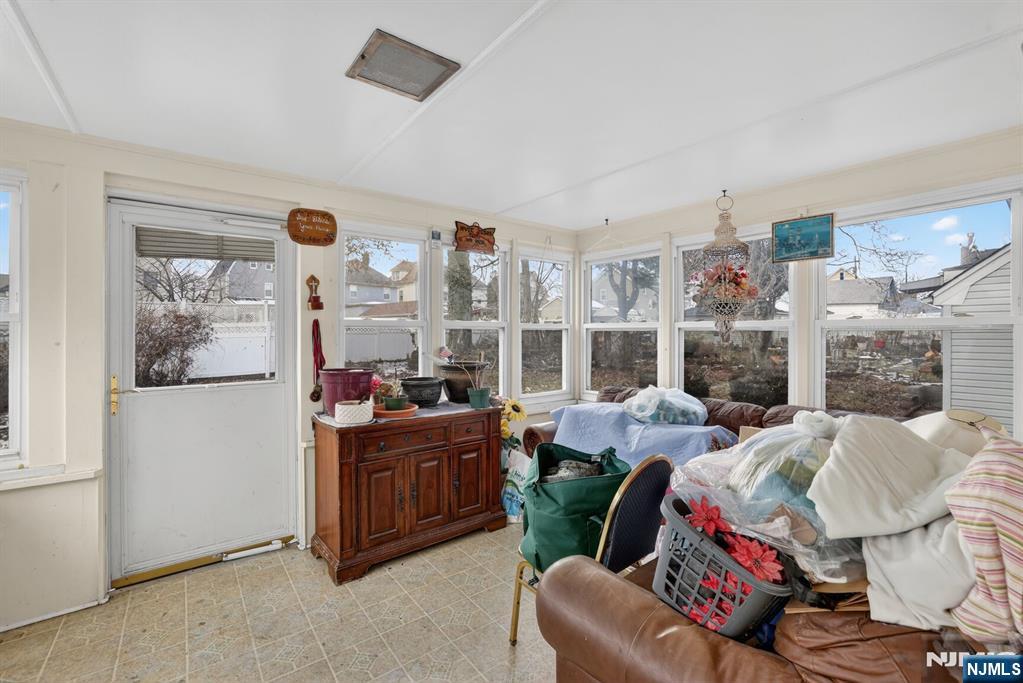 736 Vivian Terrace Union, NJ 07083 - Photo 9 of 16 a living room with furniture and a fireplace