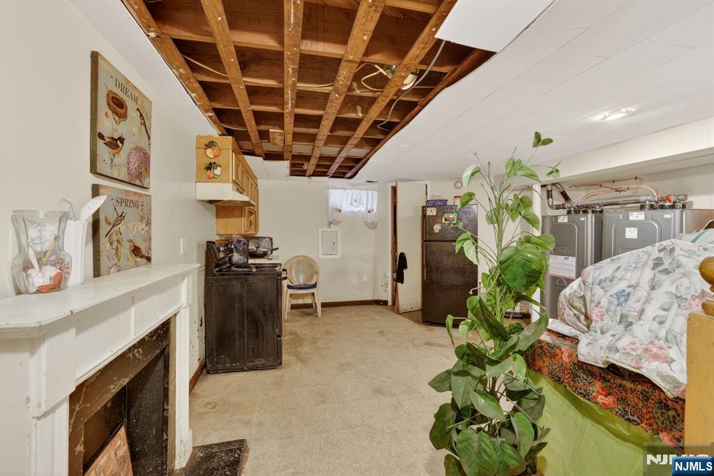 736 Vivian Terrace Union, NJ 07083 - Photo 10 of 16 a living room with furniture and a fireplace