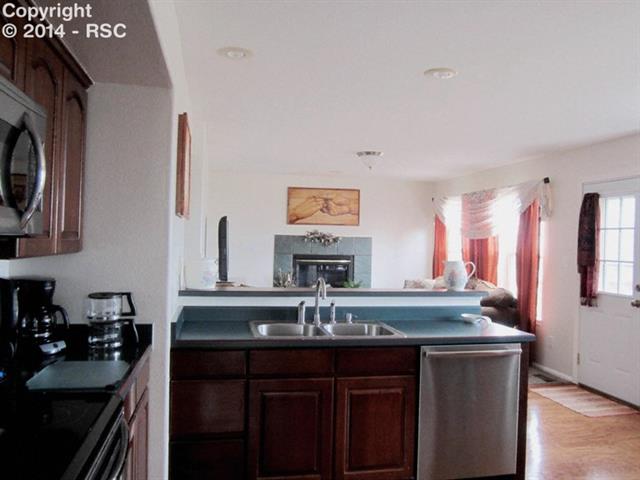 11707 Denver Road Peyton, CO 80831 - Photo 6 of 17 Looking from the kitchen area into the family room.