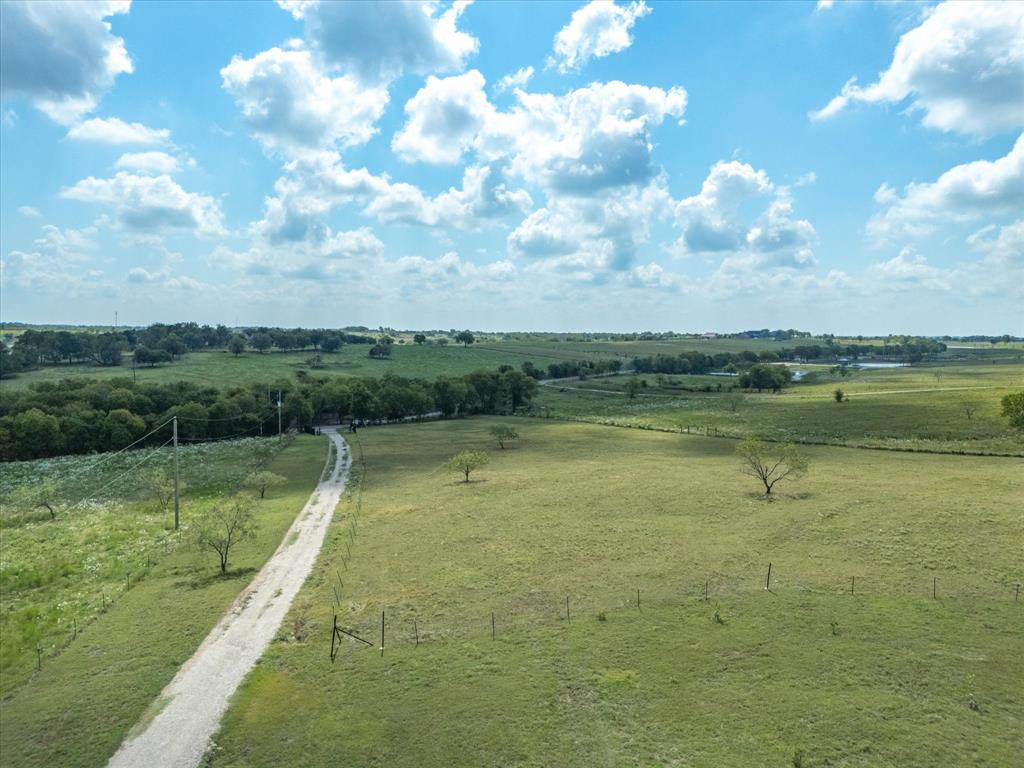 781 Alsdorf Road Ennis, TX 75119 - Photo 37 of 39 a view of a lake with a big yard