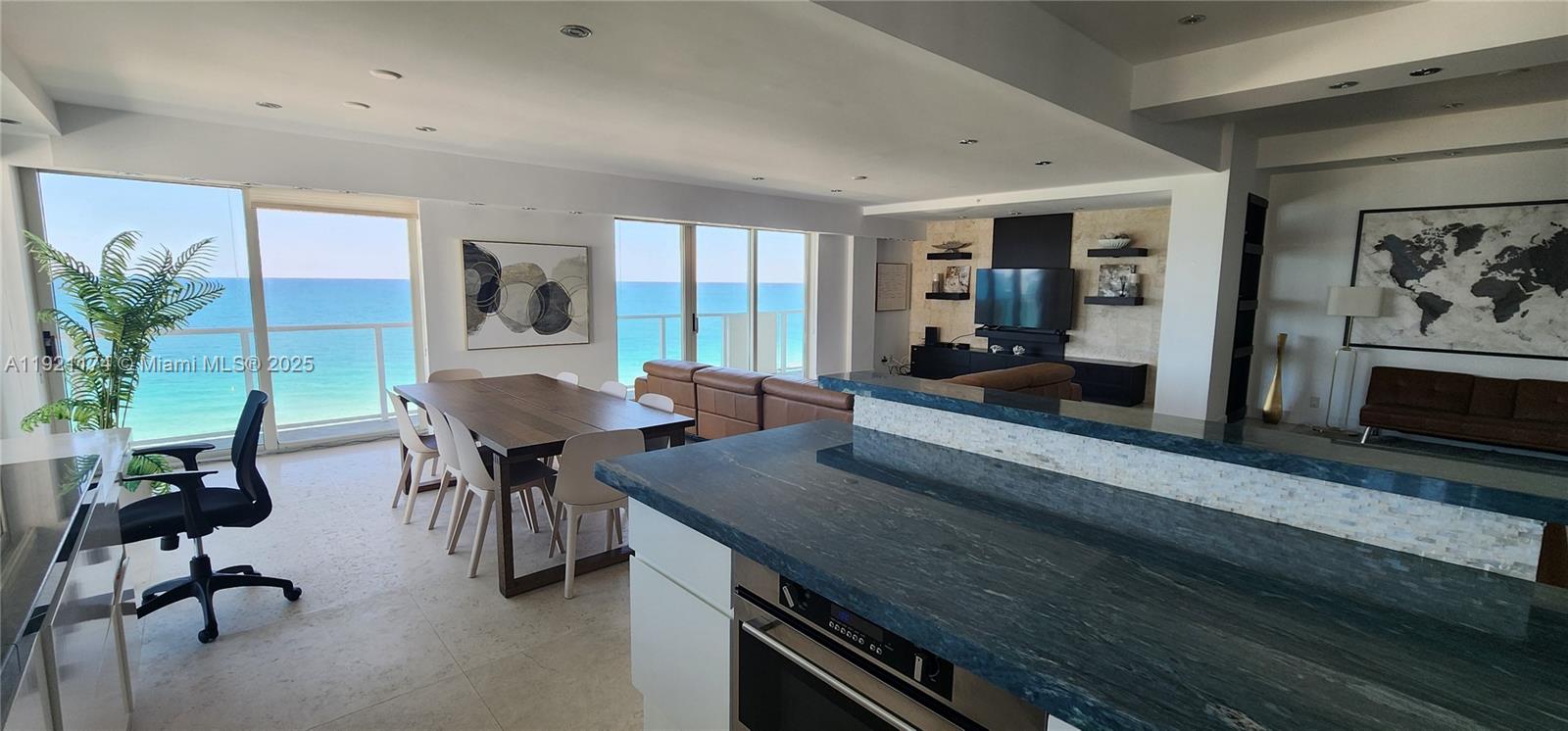 9499 Collins Avenue, Unit PH02 Surfside, FL 33154 - Photo 13 of 19 a view of a dining room with furniture