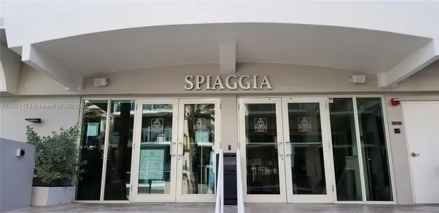front view of a building with a potted plant