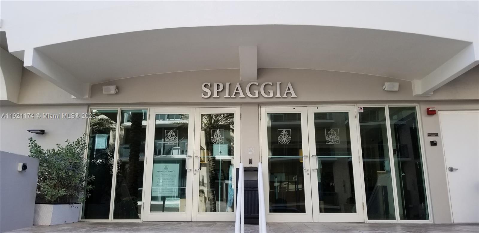 9499 Collins Avenue, Unit PH02 Surfside, FL 33154 - Photo 3 of 19 front view of a building with a potted plant