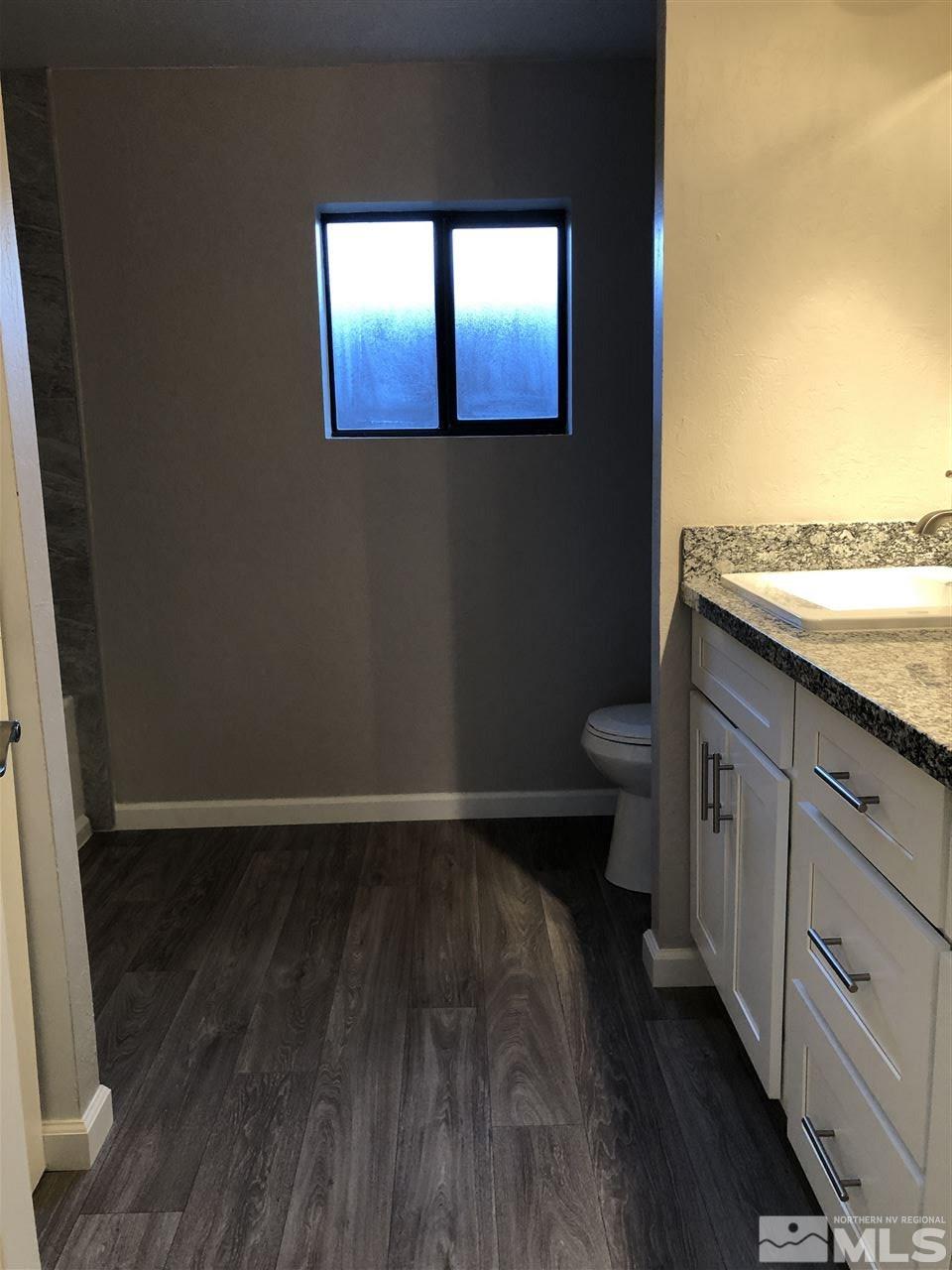 2631 Zinnia Avenue Reno, NV 89512 - Photo 11 of 15 a view of a hallway with wooden floor and a window