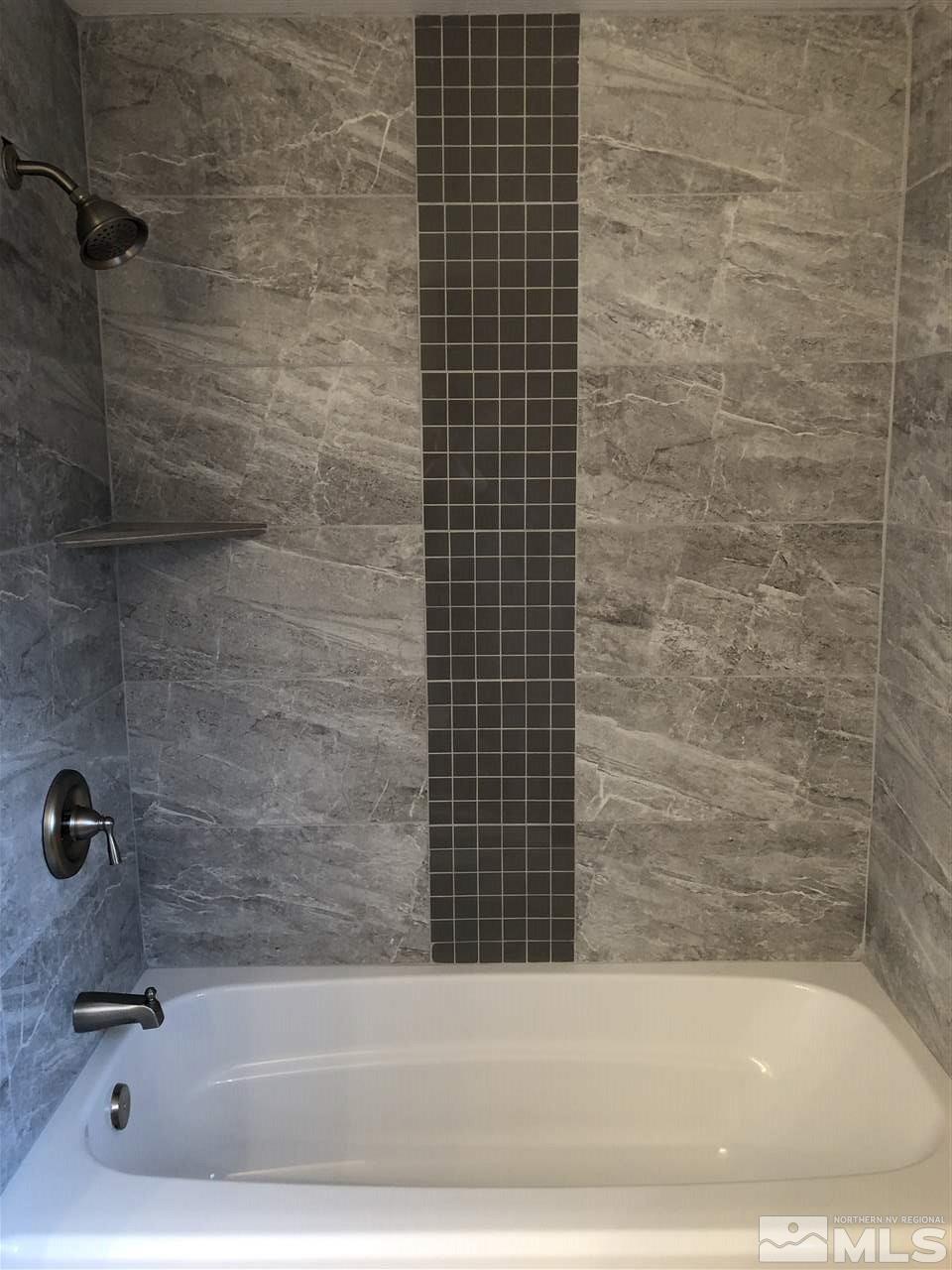 2631 Zinnia Avenue Reno, NV 89512 - Photo 12 of 15 a bathroom with a bathtub