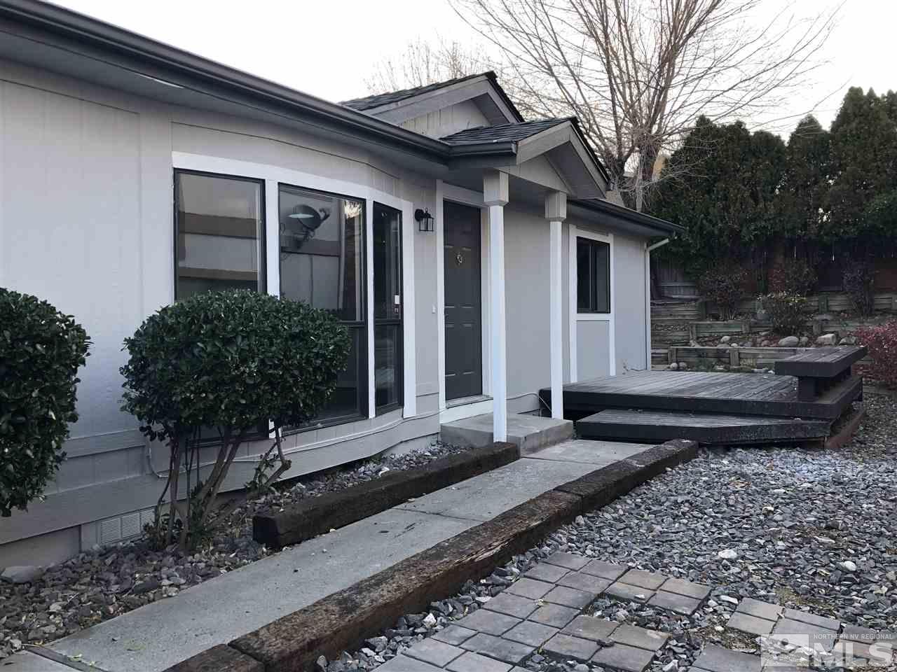 2631 Zinnia Avenue Reno, NV 89512 - Photo 3 of 15 a front view of a house with garden