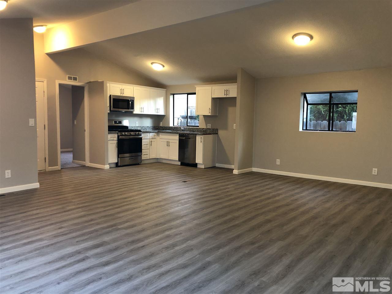 2631 Zinnia Avenue Reno, NV 89512 - Photo 4 of 15 wooden floor and kitchen view