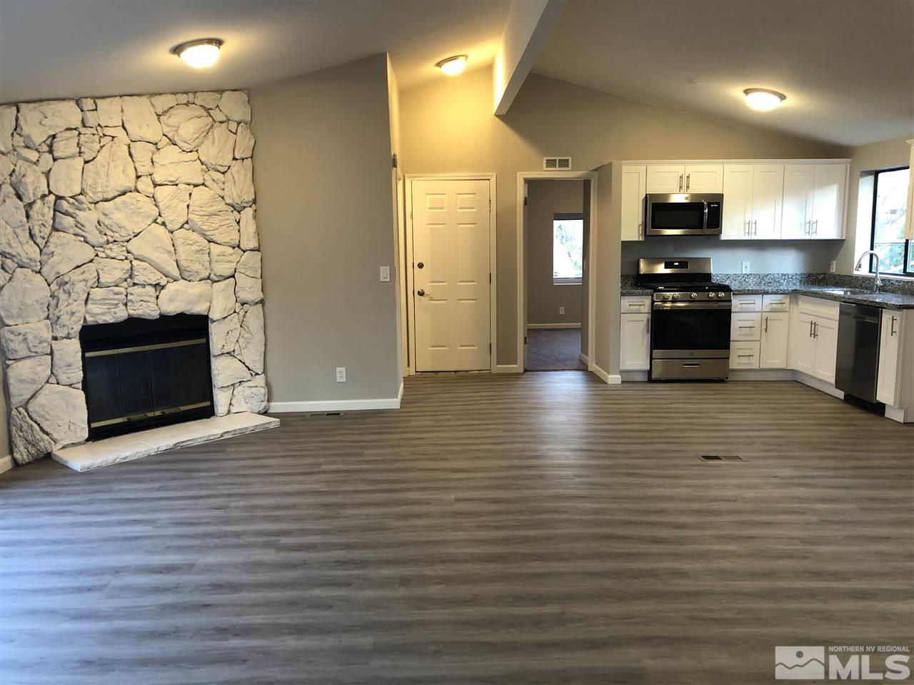 2631 Zinnia Avenue Reno, NV 89512 - Photo 5 of 15 a view of an empty room and fire place