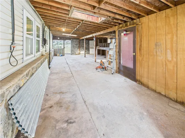 a view of a patio with table and chairs
