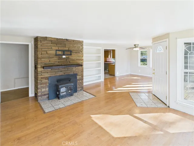 a view of a livingroom with an empty space and fire place