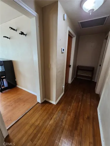a view of a room with wooden floor and stairs