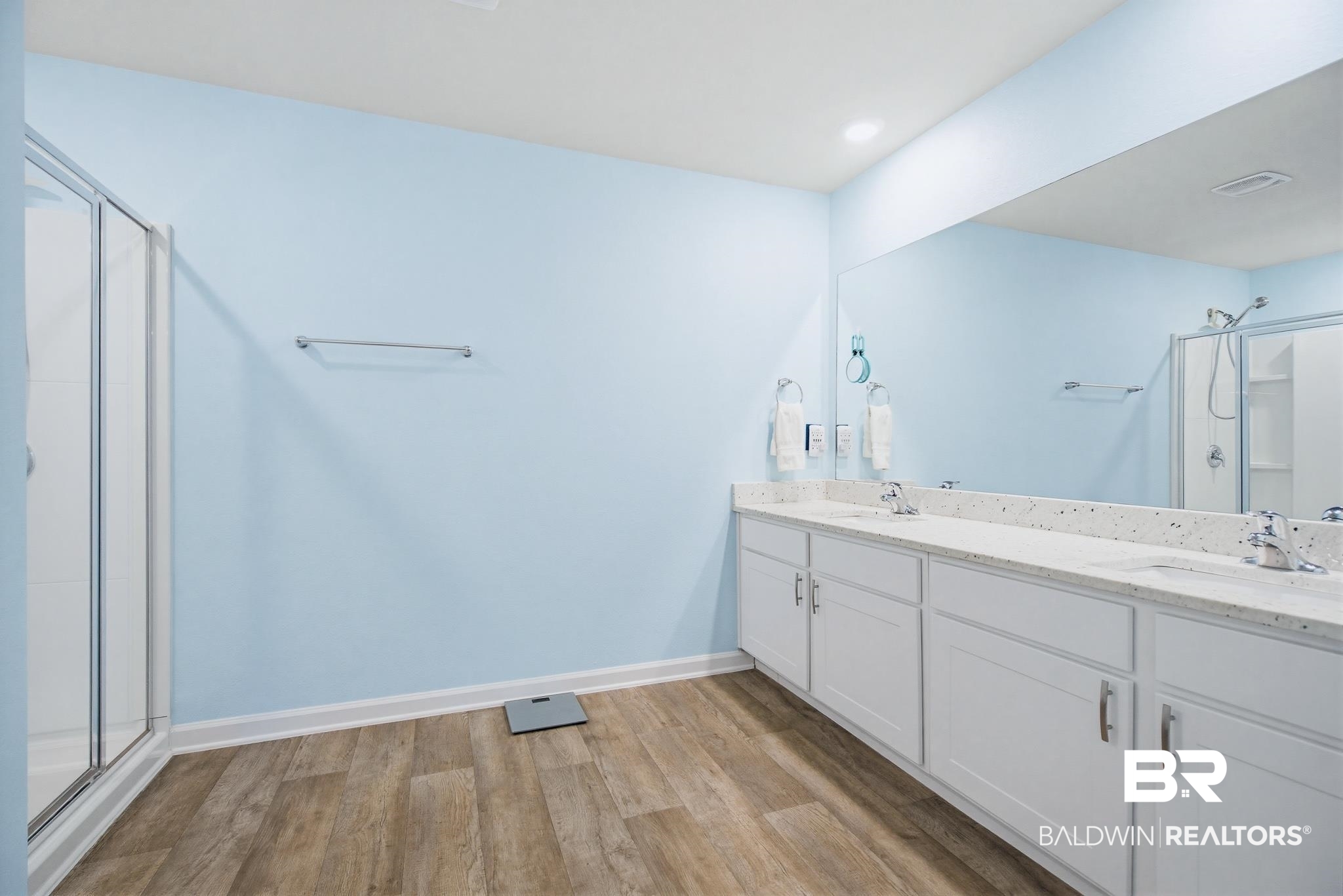 261 Fulham Lane Foley, AL 36535 - Photo 36 of 50 Full bathroom featuring a shower stall, double vanity, and light wood finished floors