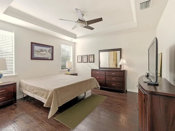 a bedroom with a bed and a dresser