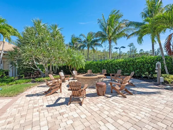 a view of a lounge chairs with a patio