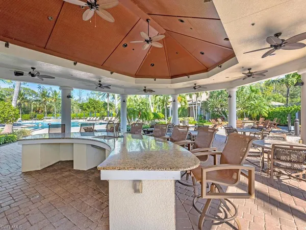 a patio with a table and chairs