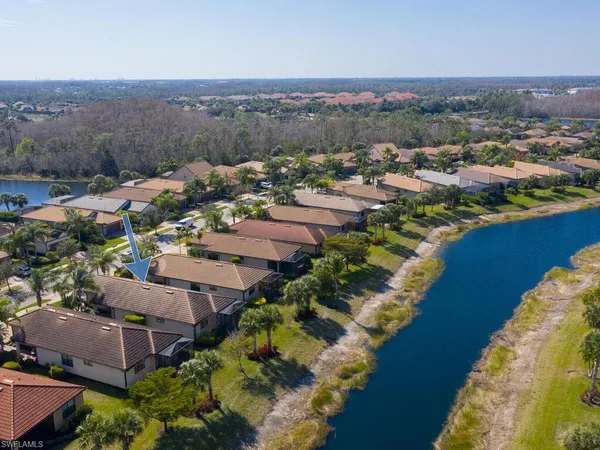 an aerial view of a house with a lake view