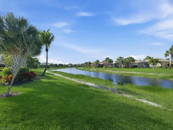 a view of a lake with a big yard