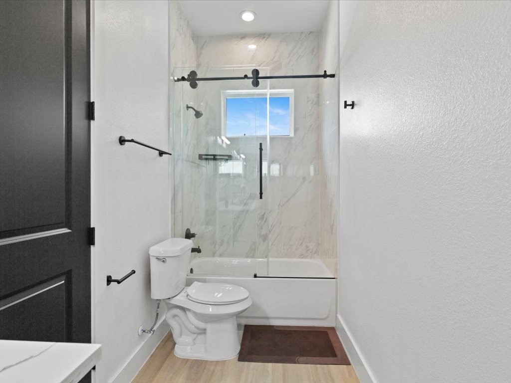 3549 Amos Street Houston, TX 77021 - Photo 13 of 25 a bathroom with a toilet and a shower