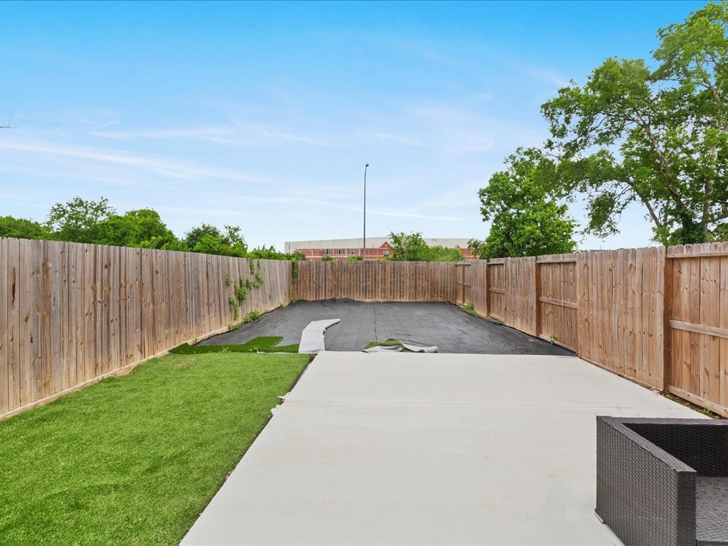 3549 Amos Street Houston, TX 77021 - Photo 14 of 25 a view of a backyard with wooden fence