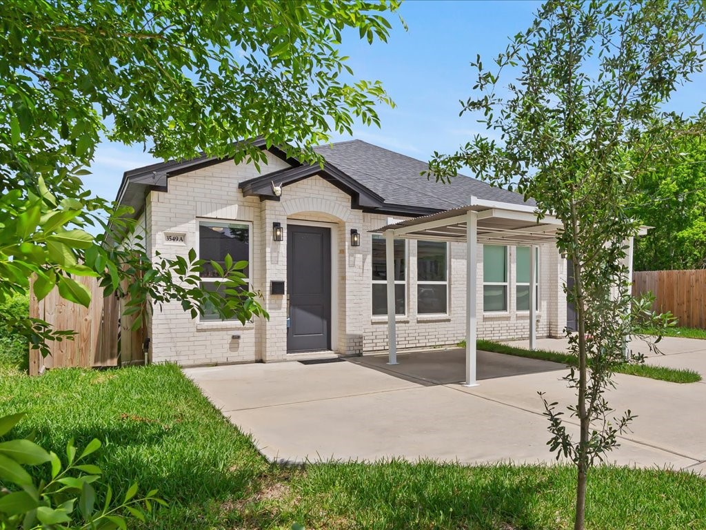 3549 Amos Street Houston, TX 77021 - Photo 18 of 25 a front view of a house with a garden and plants