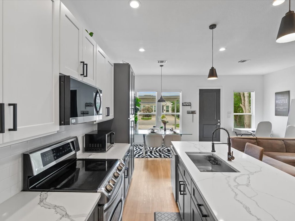 3549 Amos Street Houston, TX 77021 - Photo 20 of 25 a kitchen with stainless steel appliances granite countertop a sink stove and cabinets