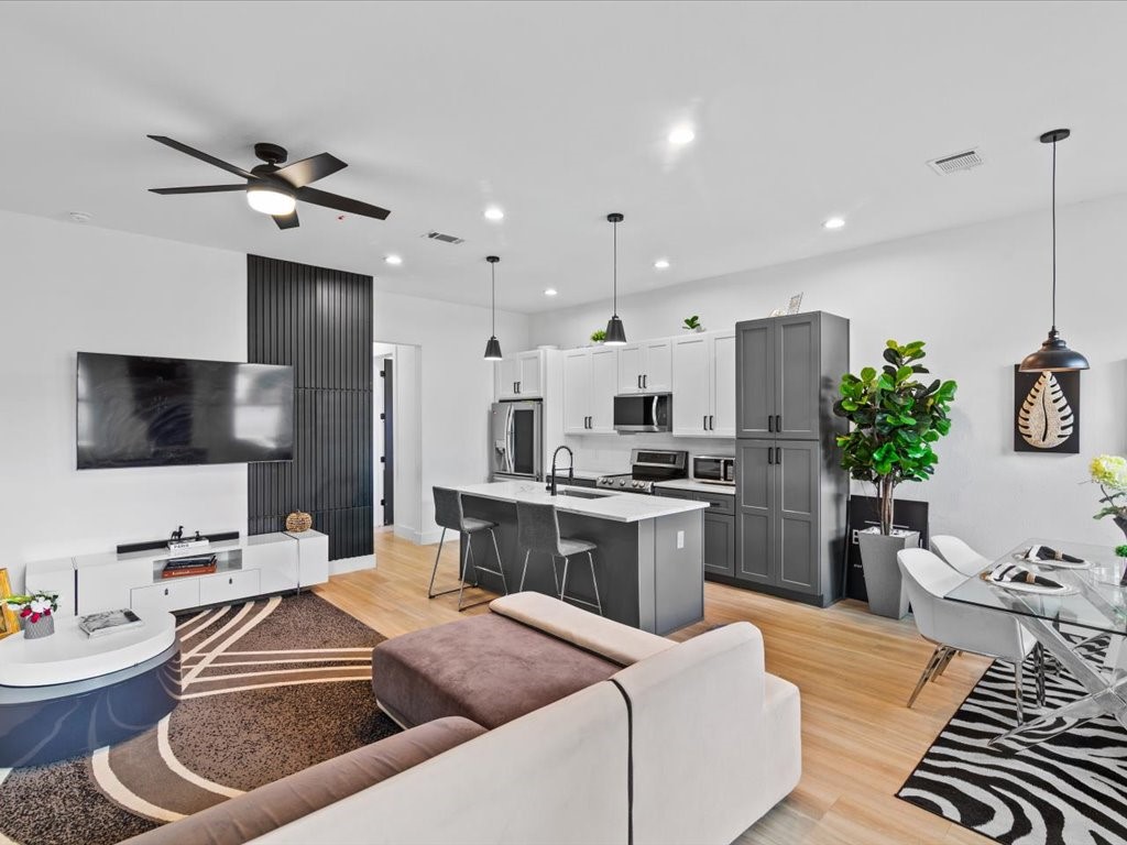 3549 Amos Street Houston, TX 77021 - Photo 2 of 25 a kitchen with stainless steel appliances kitchen island granite countertop a sink a stove and a refrigerator