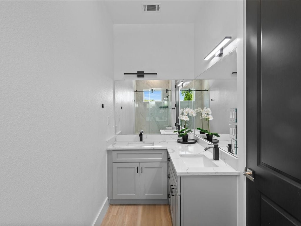 3549 Amos Street Houston, TX 77021 - Photo 6 of 25 a bathroom with a sink a toilet and mirror