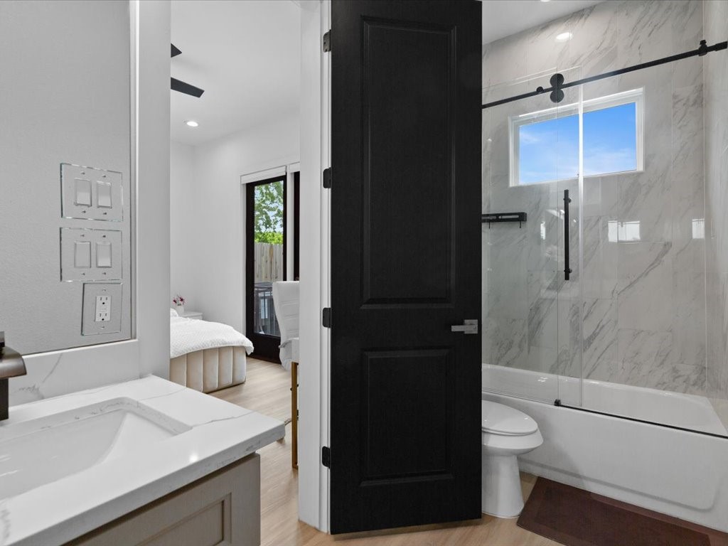 3549 Amos Street Houston, TX 77021 - Photo 7 of 25 a bathroom with a sink a toilet and shower