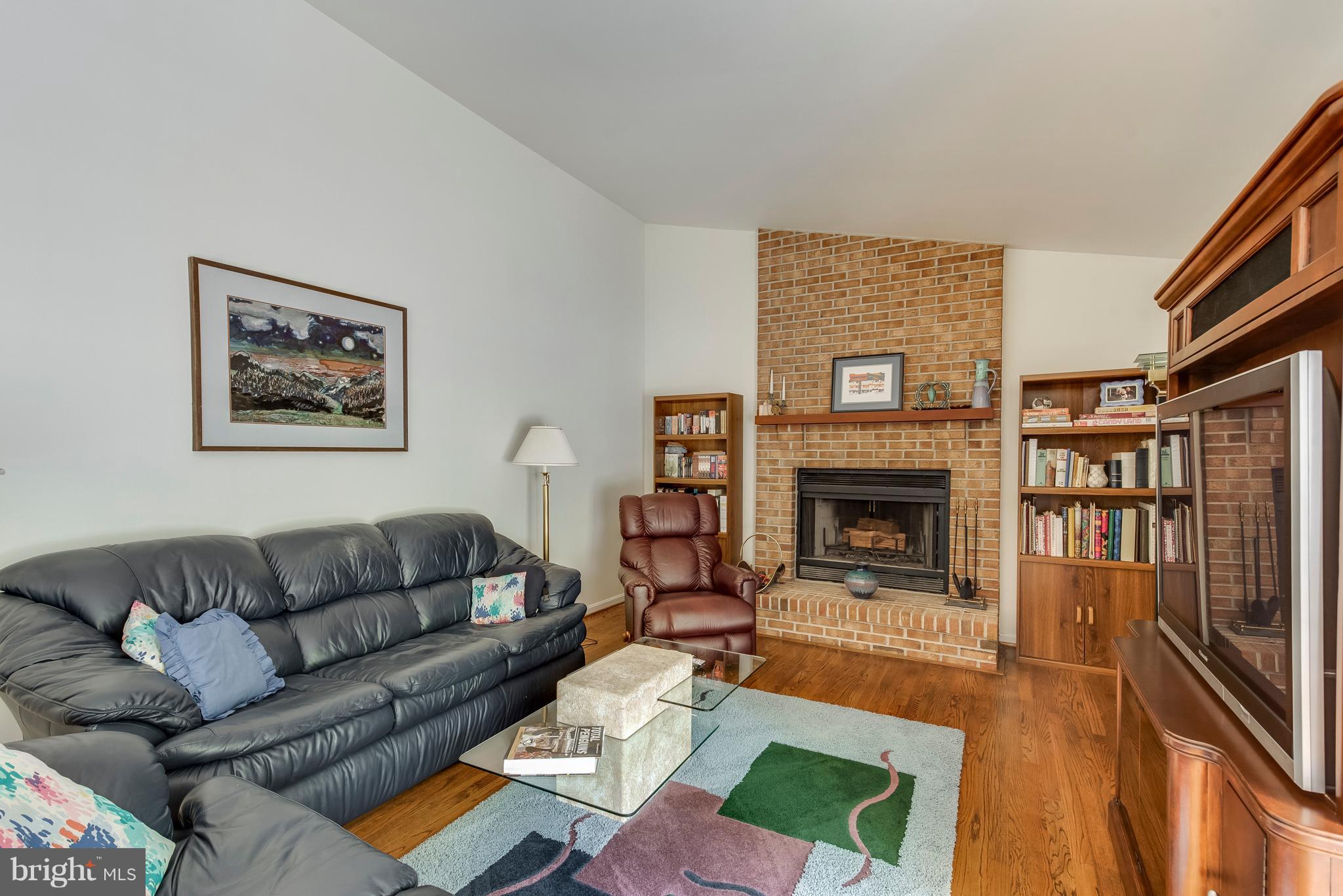 410 Riding Ridge Road Annapolis, MD 21403 - Photo 12 of 27 Family room with wood burning brick fireplace
