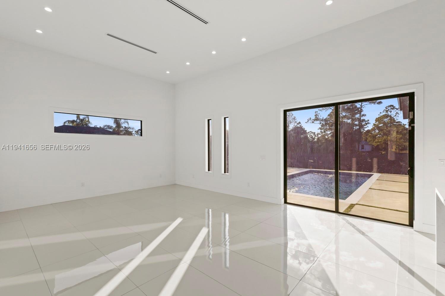 1236 East County Lehigh Acres, FL 33974 - Photo 13 of 44 a view of an empty room with a window