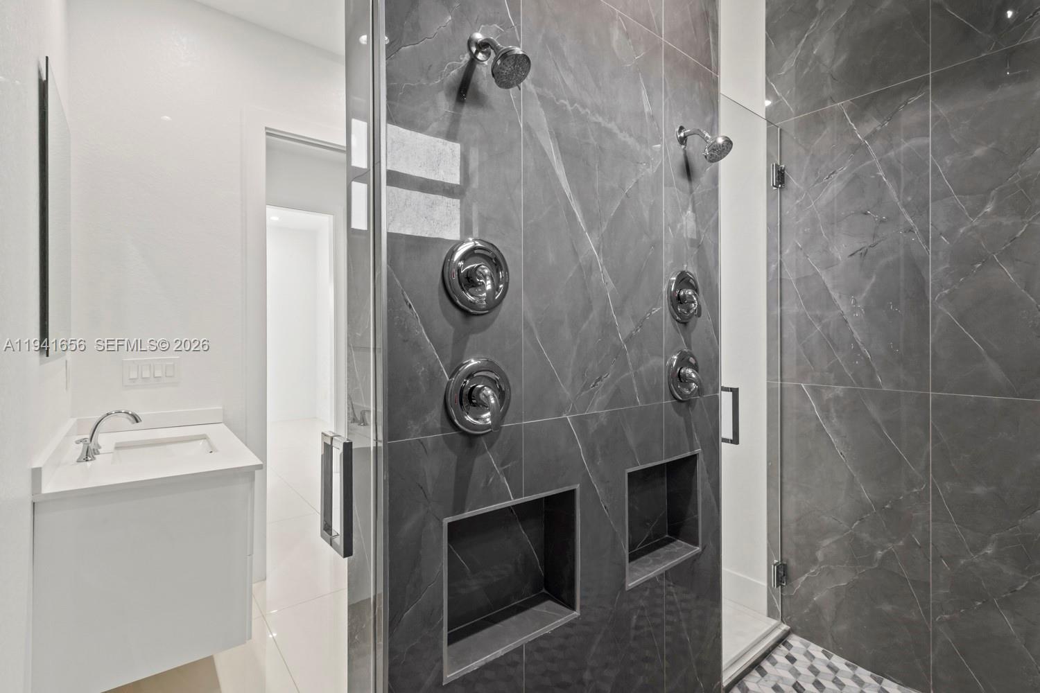 1236 East County Lehigh Acres, FL 33974 - Photo 19 of 44 a bathroom with a sink and shower