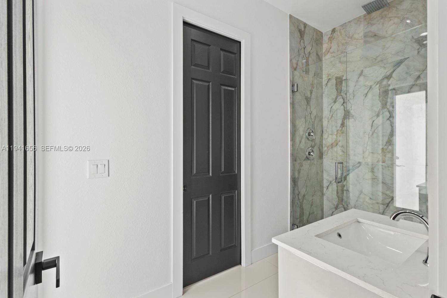 1236 East County Lehigh Acres, FL 33974 - Photo 26 of 44 a bathroom with a bathtub and shower