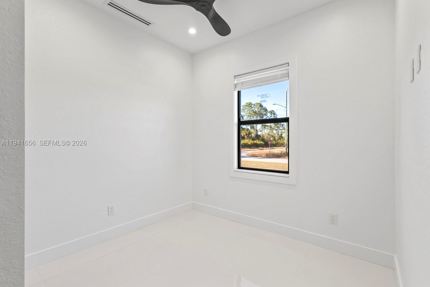 1236 East County Lehigh Acres, FL 33974 - Photo 28 of 44 an empty room with a window