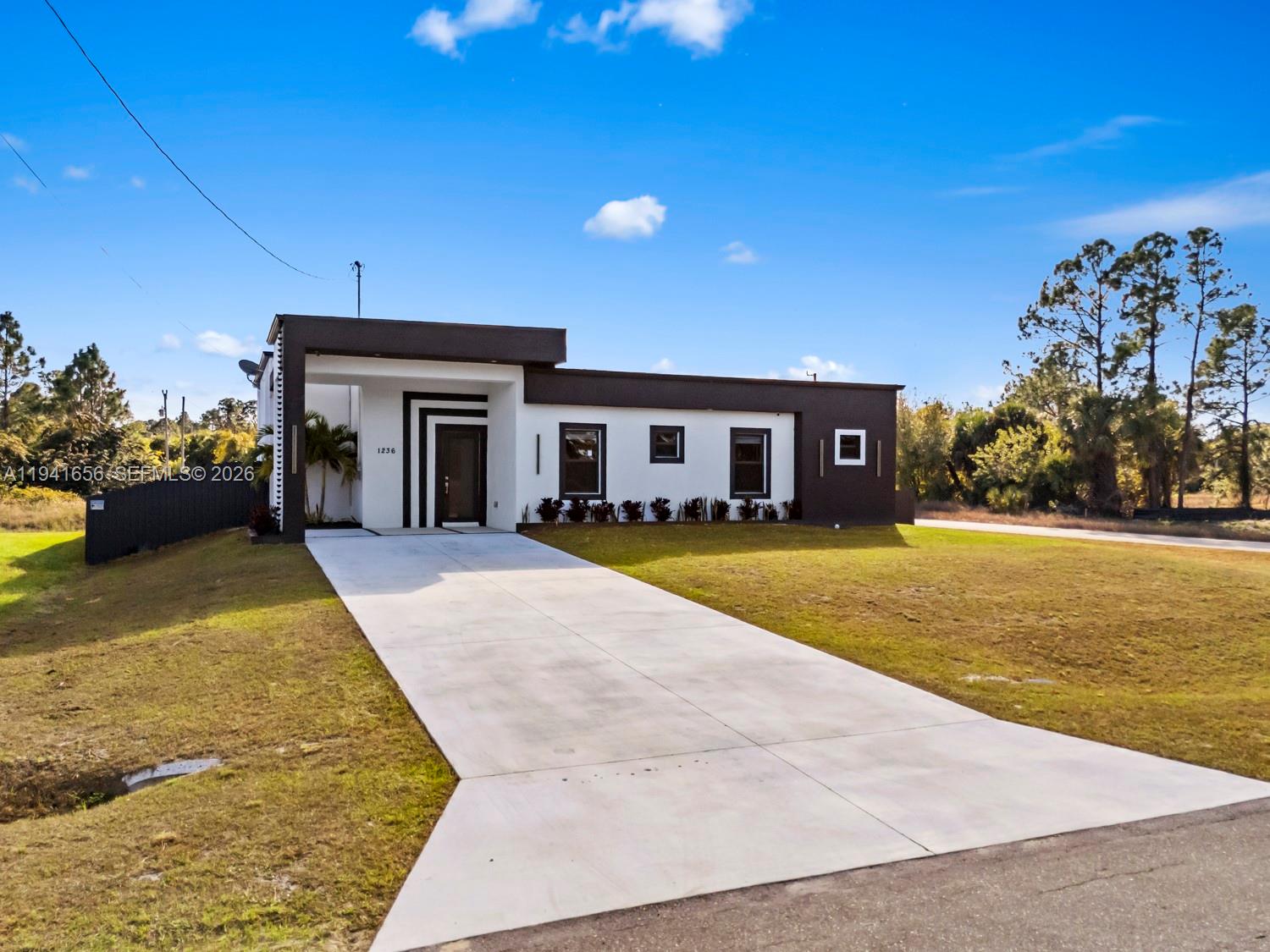 1236 East County Lehigh Acres, FL 33974 - Photo 3 of 44 a view of swimming pool with outdoor seating