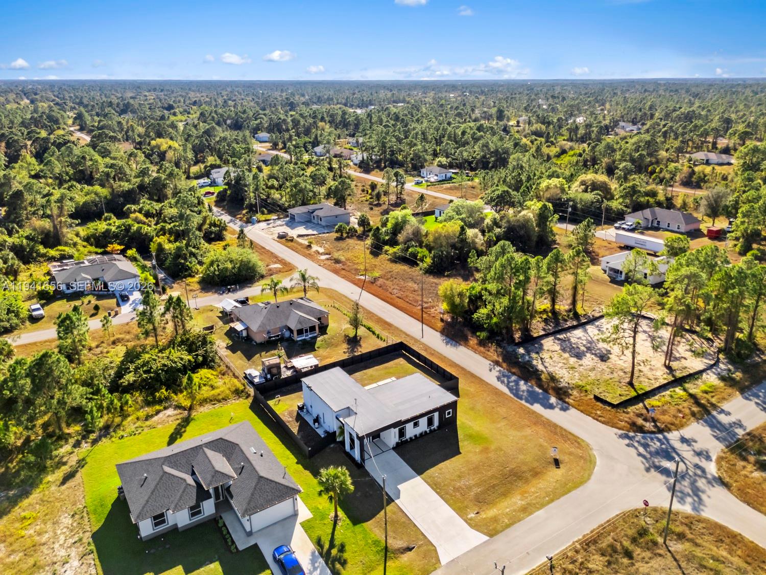 1236 East County Lehigh Acres, FL 33974 - Photo 36 of 44 an aerial view of residential houses with outdoor space