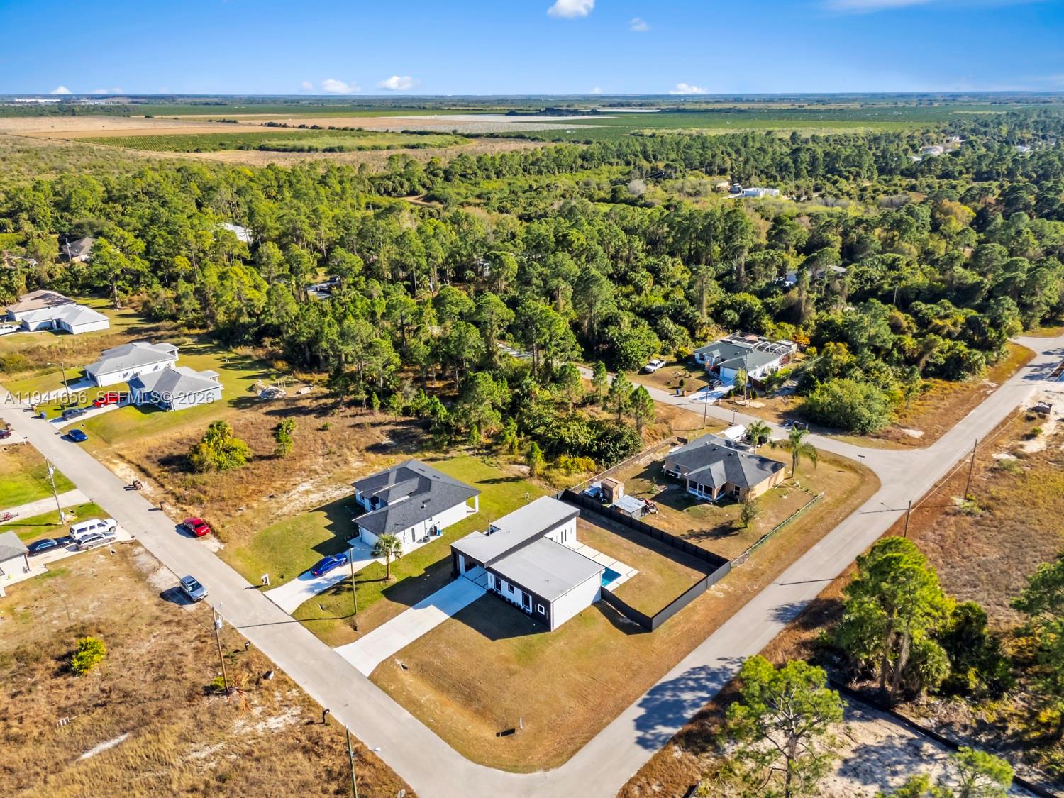 1236 East County Lehigh Acres, FL 33974 - Photo 37 of 44 an aerial view of residential houses with outdoor space