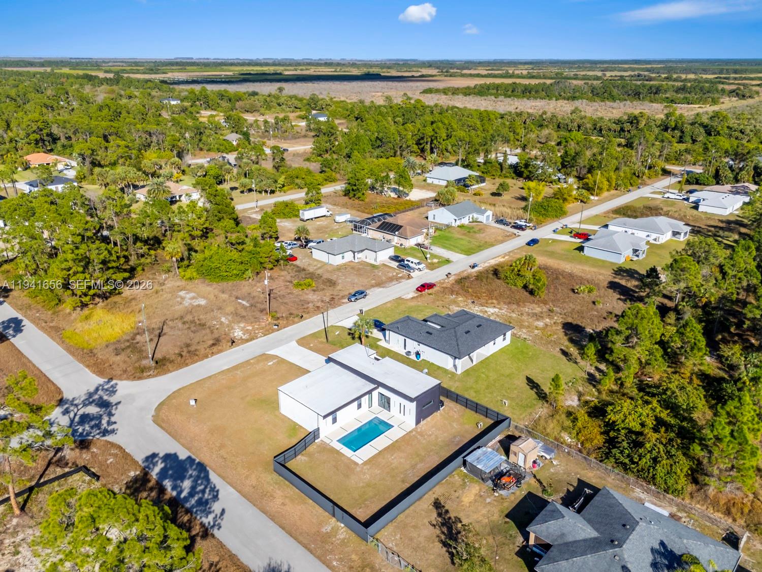 1236 East County Lehigh Acres, FL 33974 - Photo 38 of 44 an aerial view of residential houses with outdoor space