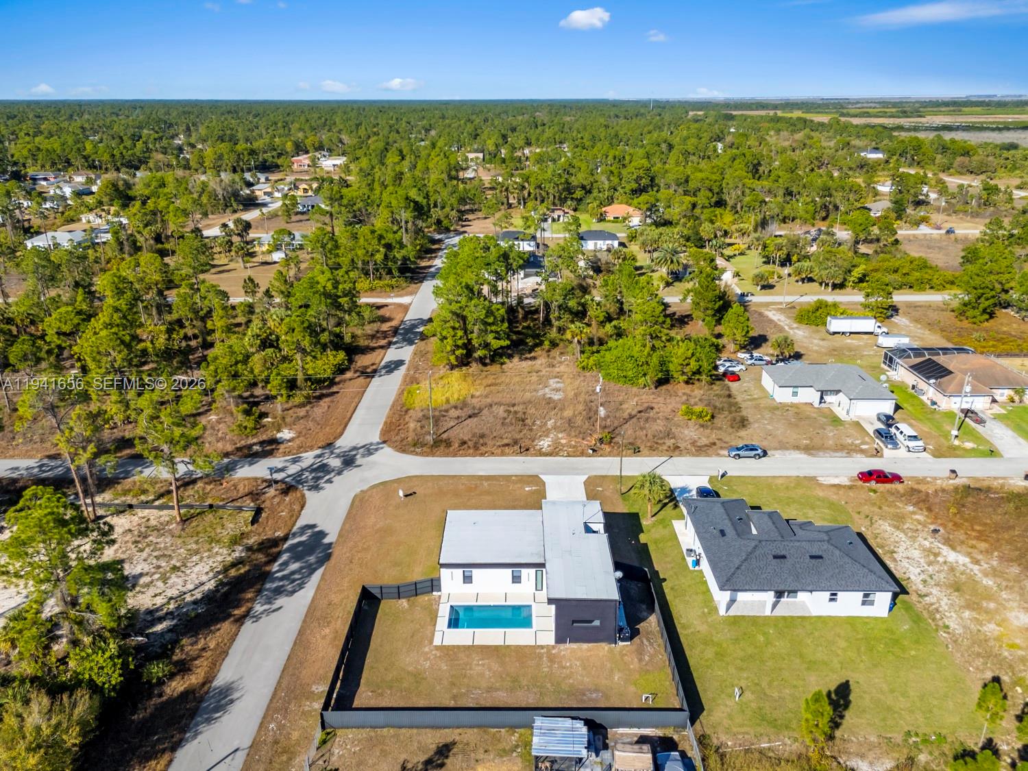 1236 East County Lehigh Acres, FL 33974 - Photo 39 of 44 an aerial view of residential houses with outdoor space