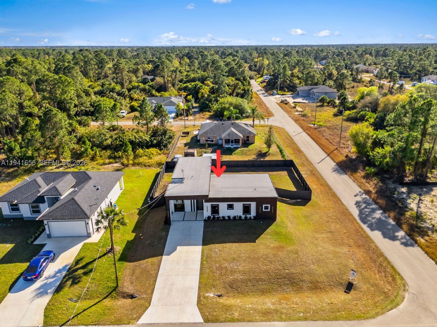 1236 East County Lehigh Acres, FL 33974 - Photo 40 of 44 an aerial view of a house with swimming pool and outdoor seating